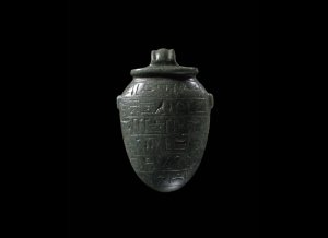 A heart amulet inscribed with magical text