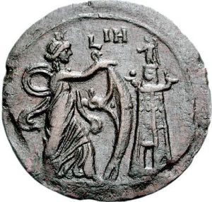 Isis Pharia with Her sail and the lighthouse on the right