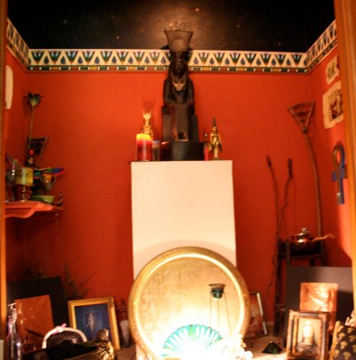 My rather image filled Isis shrine. We sacrificed a double closet to give Her this space.