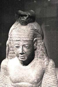 A scribe in the Kheper of Thoth (note the baboon of Thoth on his head) writing