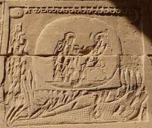 A rather destroyed image of Osiris on the back of a crocodile, Isis before them