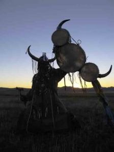 A Mongolian shaman making offering